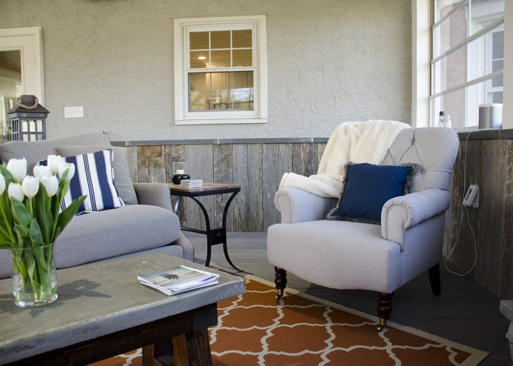 enclosed porch with decorative rug weather-proof patio rug