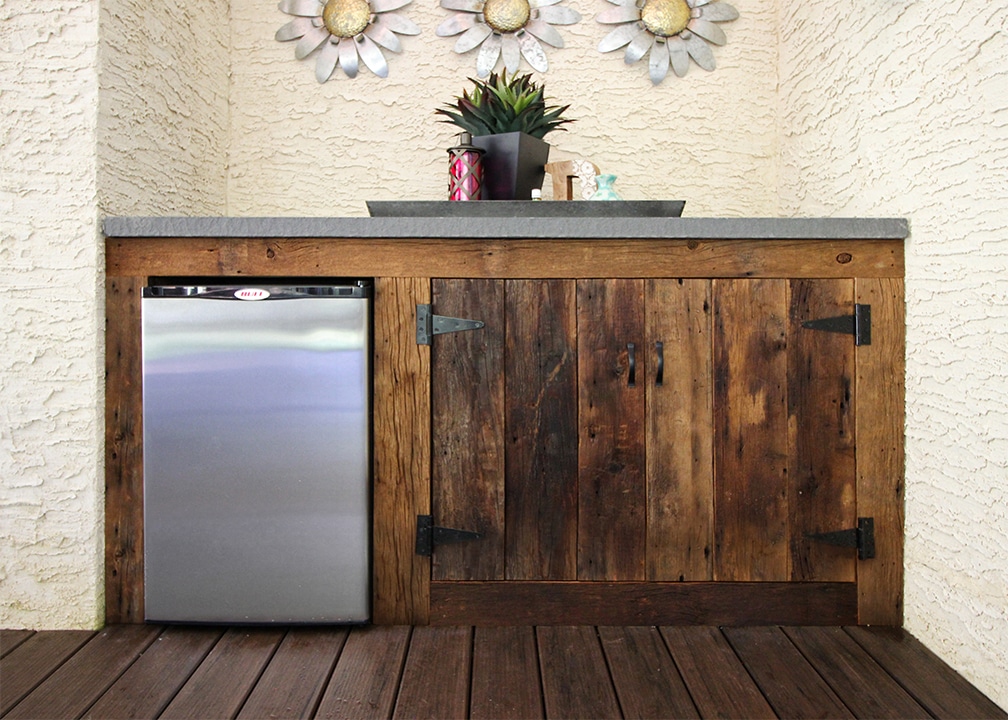 outdoor kitchen with refrigerator and polished bluestone countertop timeless outdoor kitchen design with reclaimed barn wood