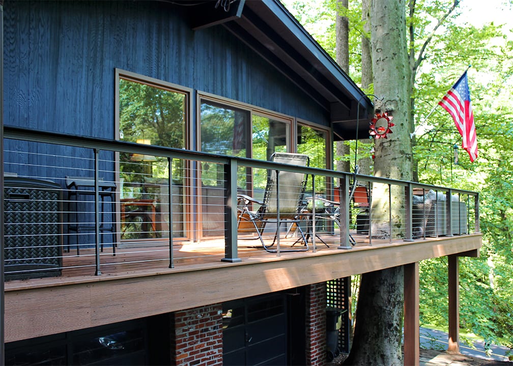 elevated backyard deck with verticable railing two story wrap around deck