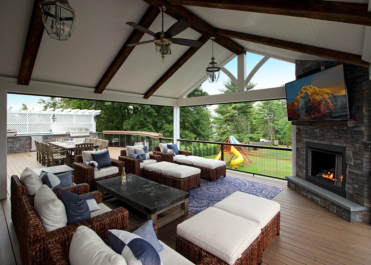 composite deck with seating area and fireplace covered composite deck
