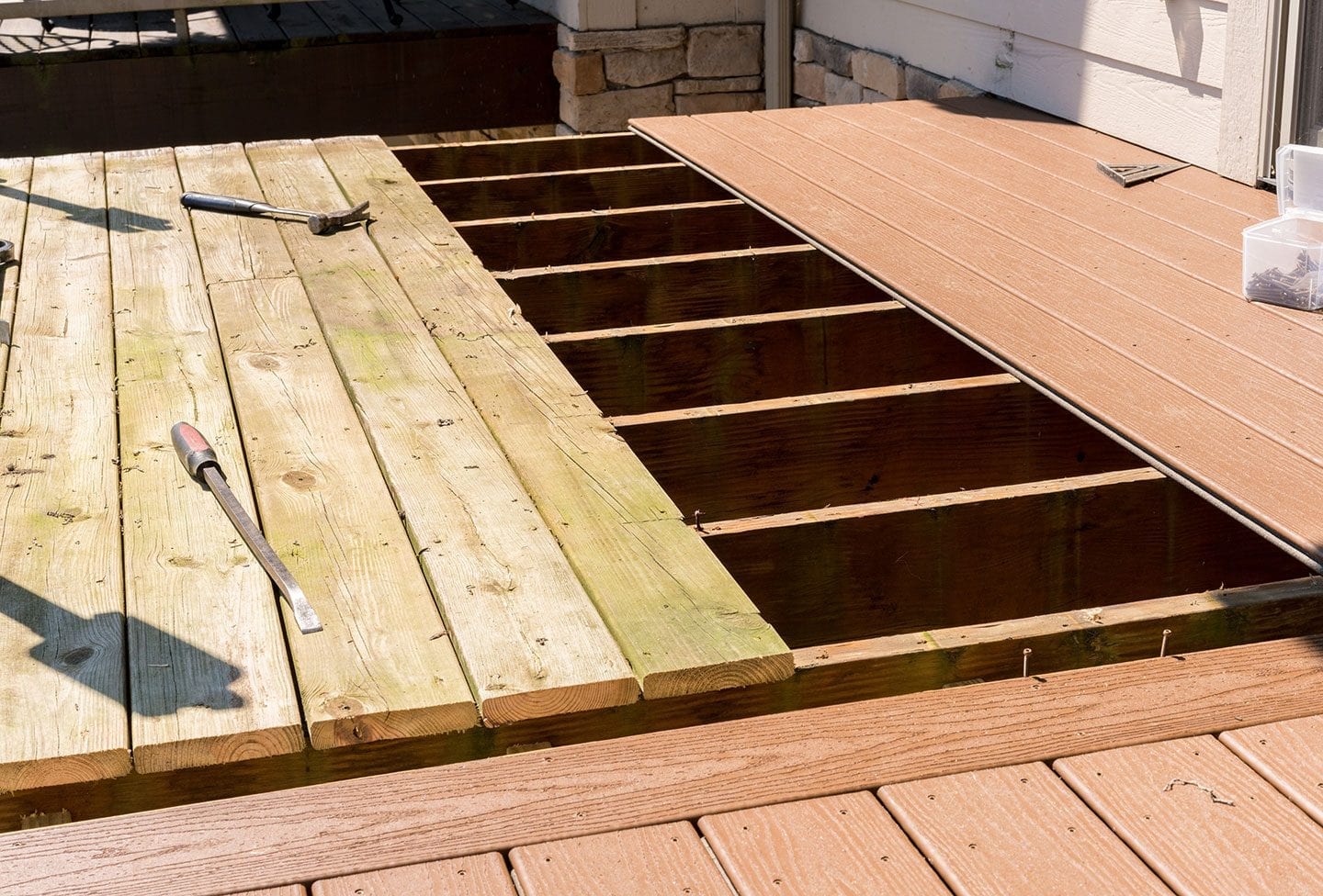replacement of old wooden deck with composite material re-decking