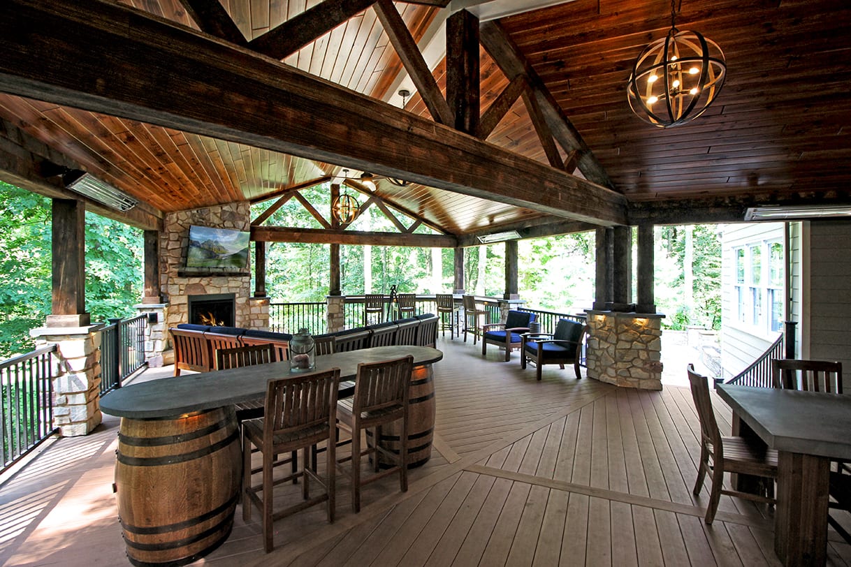 deck with reclaimed barn wood and authentic jack daniels barrels deck design using found material and artifacts