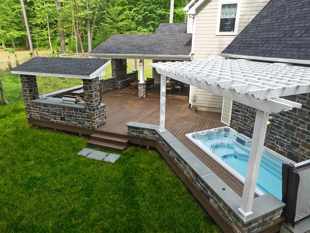 in-ground hot tub built into 12’X12’ deck space deck with in-ground hot tub