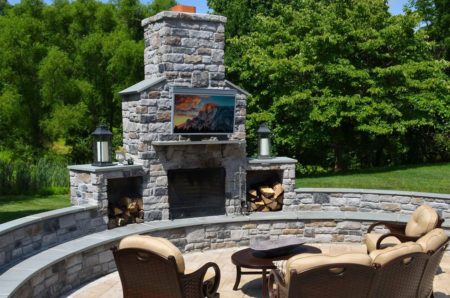 skyvue outdoor weatherproof tv mounted to stone chimney skyvue outdoor weatherproof tv